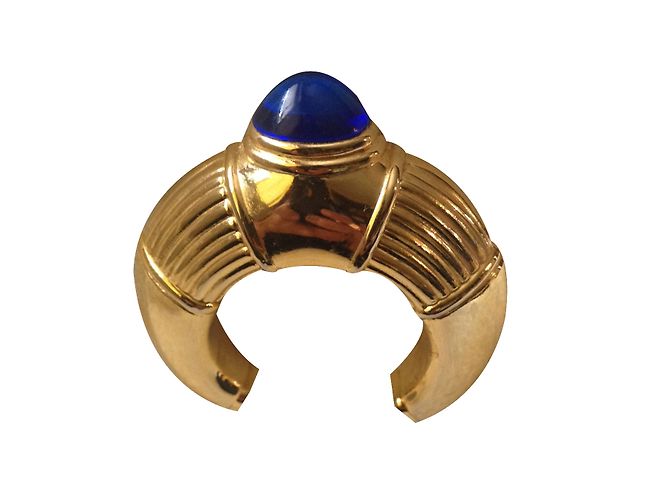 Spilla Boucheron in metallo dorato con cabochon blu D'oro