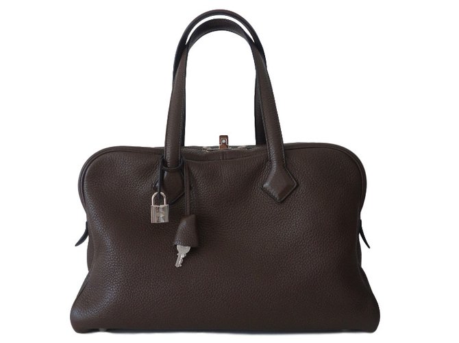 Hermès Handbags Dark brown Leather  ref.37539