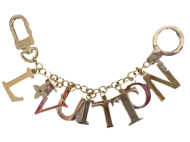 Louis Vuitton Amuleto bolsa Dorado Metal  ref.38974