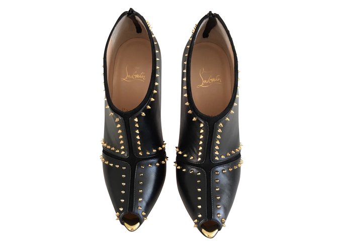 Christian Louboutin Ankle boots Caraphachoc model black & gold Leather  ref.48088