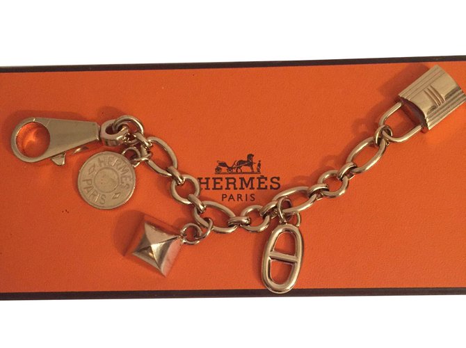 Hermès Amuletos bolsa Dorado Metal  ref.61011