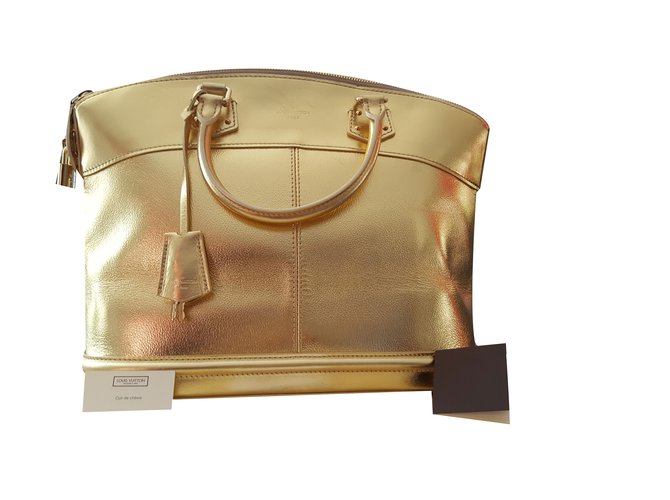 Louis Vuitton LOCKIT MM SUHALI Golden Metallic Leather Goatskin  ref.70703