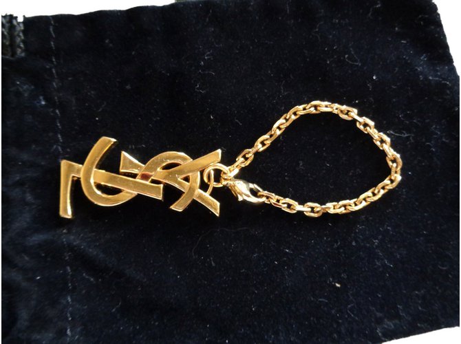 Yves Saint Laurent Amuletos bolsa Dorado Metal  ref.75760