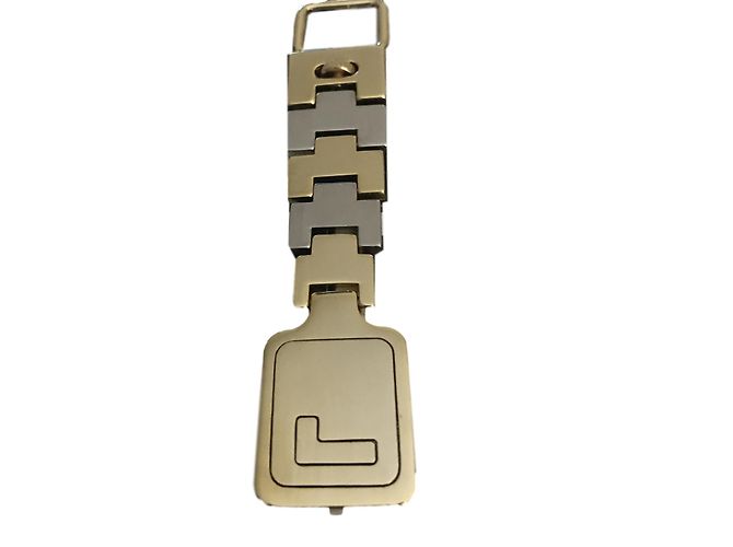Ciondolo per borsa Lancel in oro e acciaio Argento D'oro