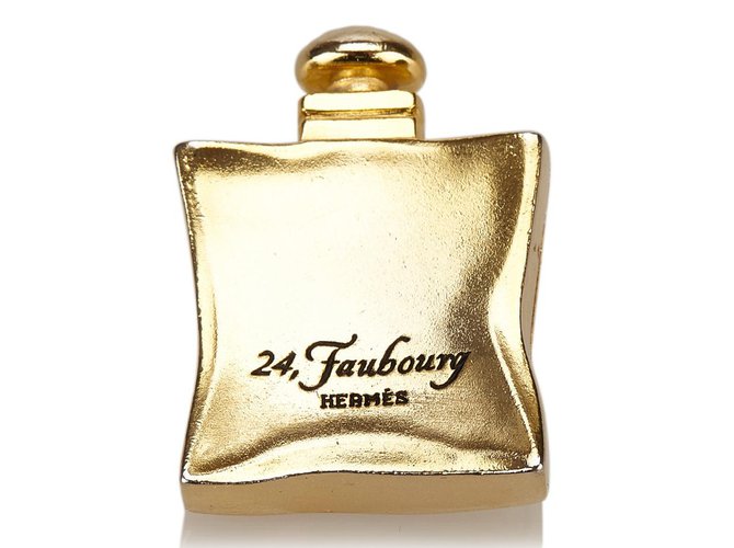 Hermès Broche de metal Dourado  ref.83063
