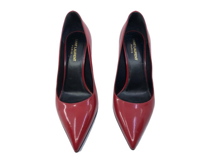 Yves Saint Laurent Tacchi Rosso Pelle  ref.84973