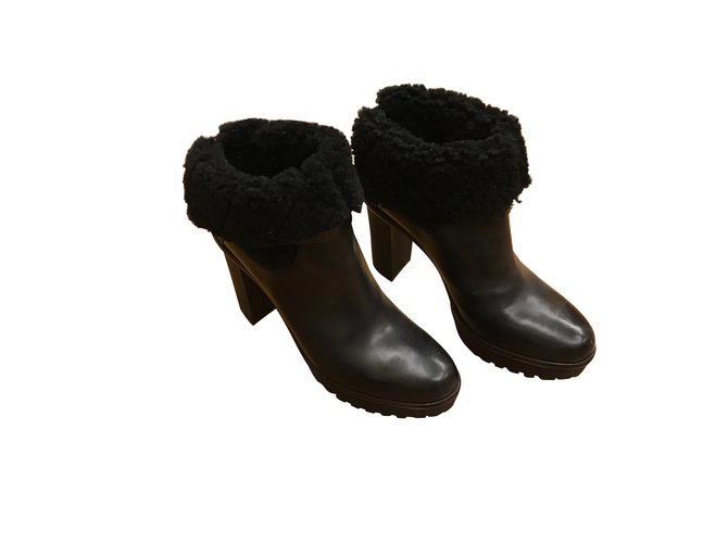 Moncler Black boots in fur interior Leather  ref.102570