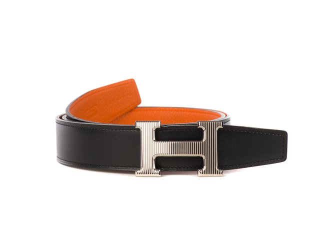 O cinto de homem Esplêndido Hermès Reverso em couro de togo laranja e preto com fivela de calendário em excelente estado!  ref.107146