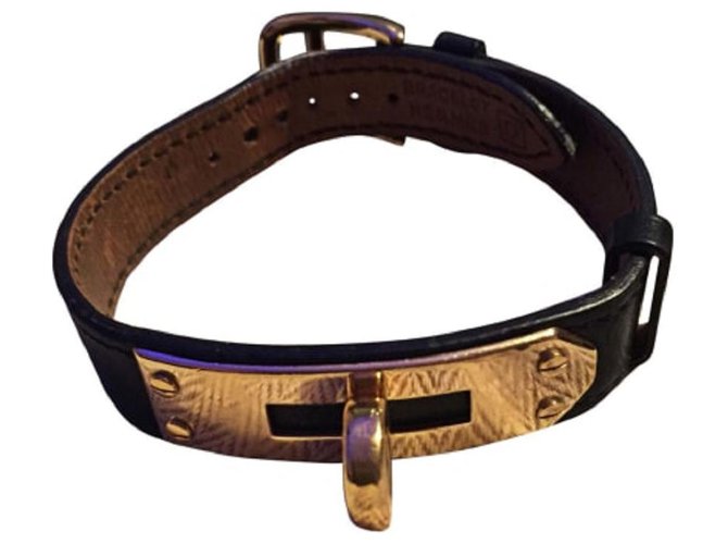 Hermès "Kelly" Armband aus vergoldetem schwarzem Kalbsleder  ref.113572
