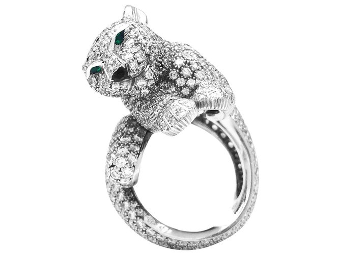Anel Cartier, Modelo "felino", Em platina, diamantes, esmeraldas e ônix.  ref.115761