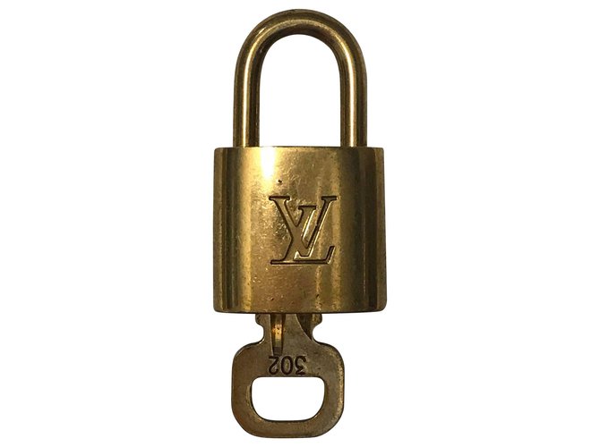 Louis Vuitton Lock Golden Metal  ref.116529