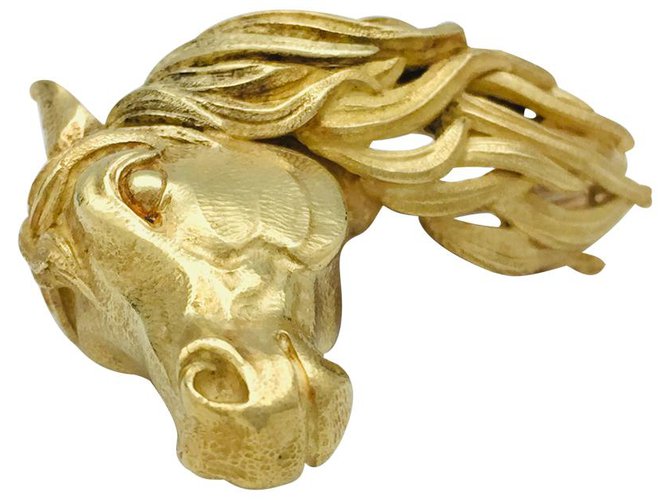 Hermès clip "Cheval" in yellow gold.  ref.122307