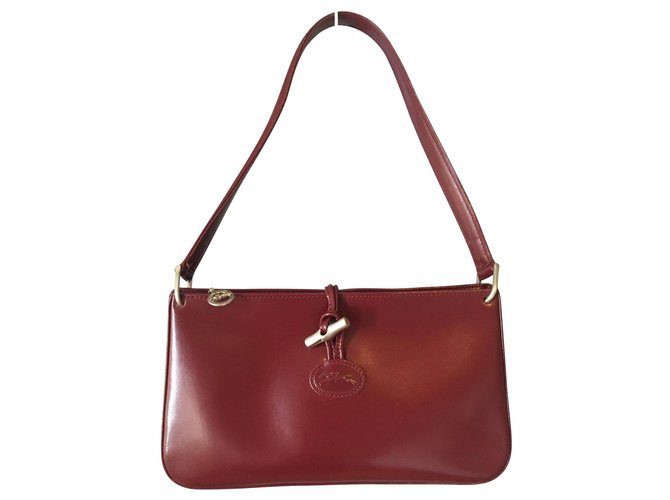 Vintage Longchamp bag, Fuseau model, cowhide leather in dark fuchsia /  burgundy tones