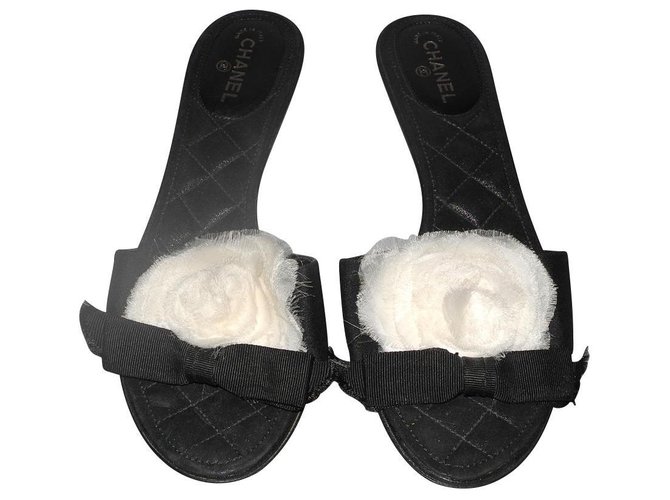 Chanel black leather and fabric mules with organza camellia White Cloth  ref.130349