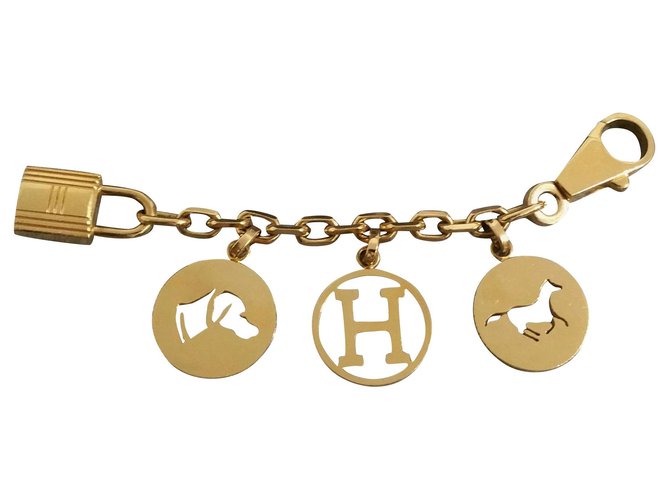 Hermès Bijou de sac Hermes Gold Breloque Métal Doré  ref.133369