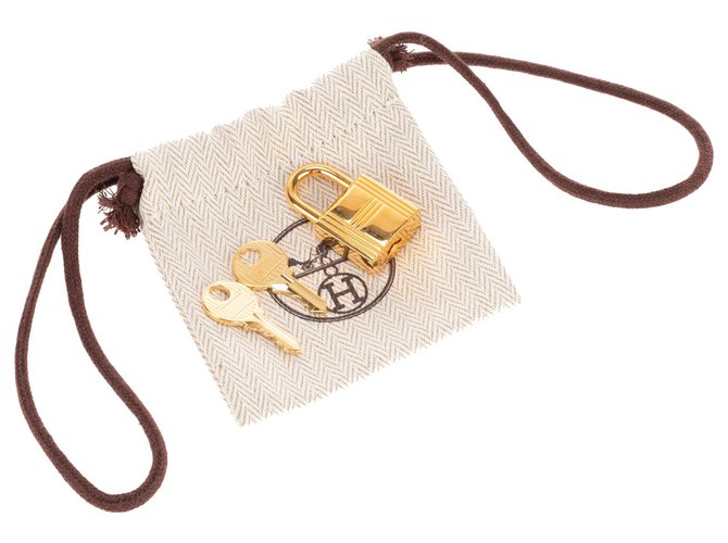 Hermès Golden Hermes padlock for Birkin or kelly bags, new condition with 2 keys and original pouch! Steel  ref.133401