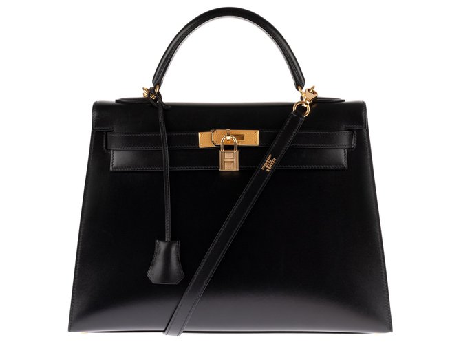 Superbe et rare joyau: Hermès Kelly sellier 32 cm à bandoulière en cuir box noir et accastillage plaqué or en excellente condition !  ref.144225