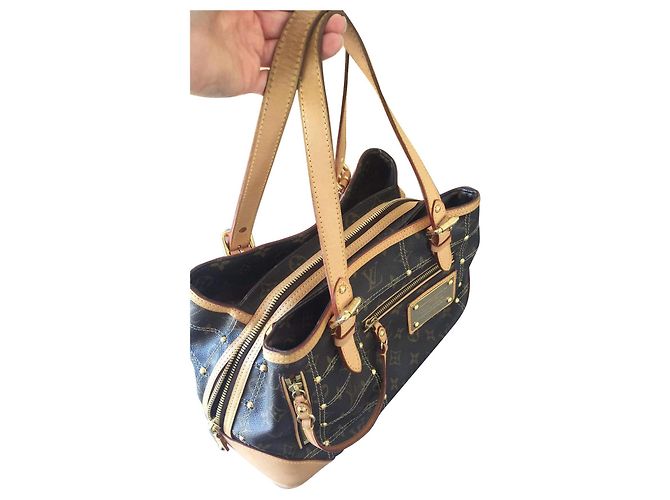 Louis Vuitton remachar Castaño