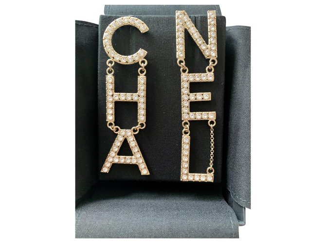 Chanel CHA NEL Crystal Logo Earrings Golden Metal  ref.159658