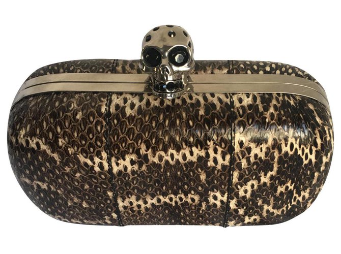 Skull clutch Alexander McQueen Silvery Multiple colors Leather Metal Python  ref.162828