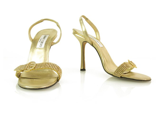 Autentico sandalo in pelle oro Jimmy Choo con cristalli hotfix e sandali con fibbia - Sz37.5 D'oro  ref.170183