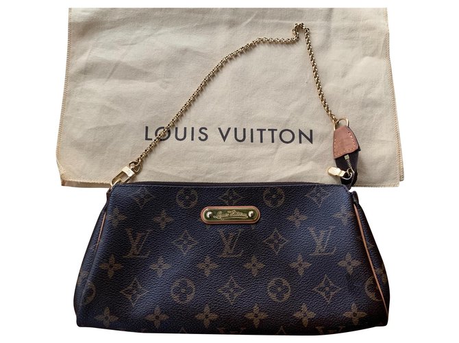 Eva cloth handbag Louis Vuitton Brown in Cloth - 29641875