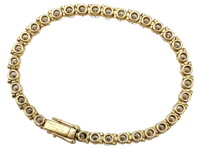 Bracelet Cartier ligne tennis serti de diamants en or jaune. Or blanc  ref.179543
