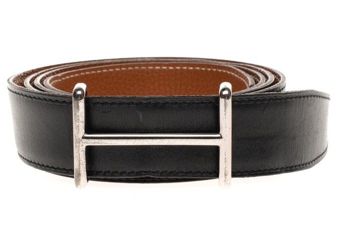 Cinturón Hermès reversible en cuero box negro y dorado Togo con hebilla ancha H en plata paladio  ref.180060