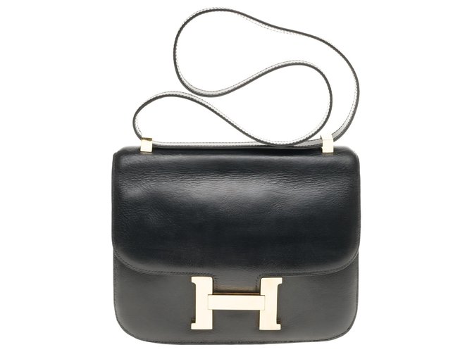 Hermès Hermes constance 23 caja de cuero negro, molduras metálicas chapadas en oro en muy buen estado  ref.183947