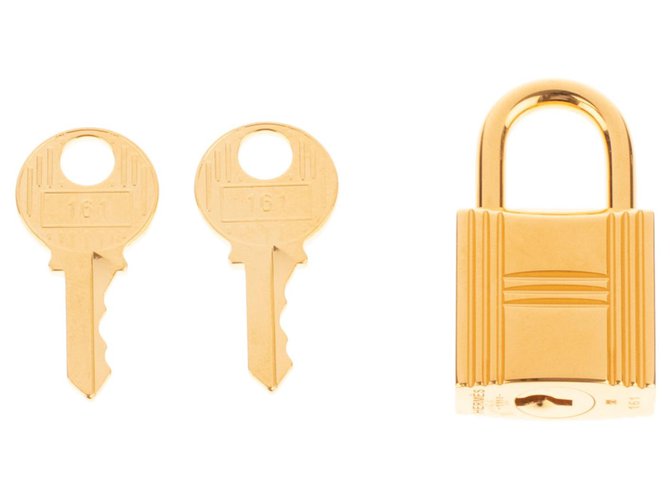 Hermès Lucchetto dorato di Hermes per borse Birkin in oro kelly, nuova condizione con 2 chiavi e custodia originale! D'oro Metallo  ref.187472
