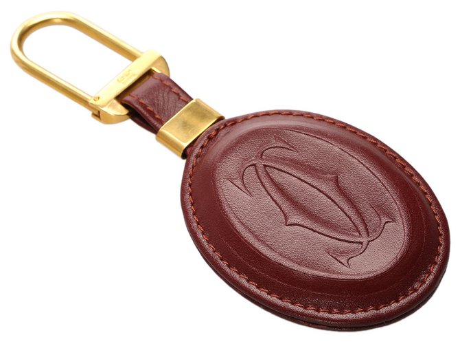 Cartier Red Must de Cartier Key Chain Golden Leather Pony-style calfskin  ref.187568