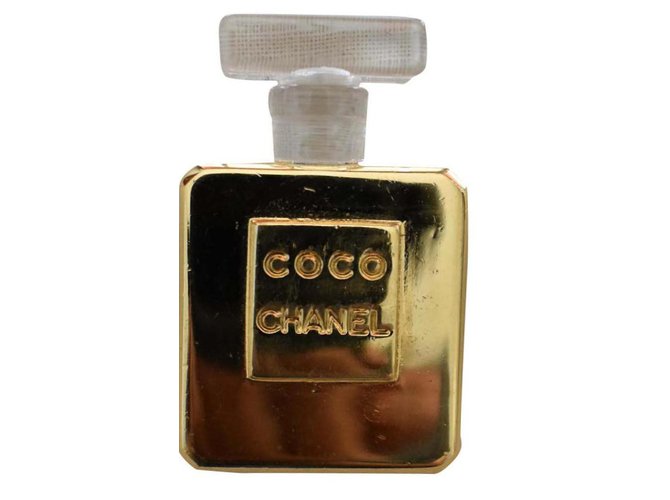 EINE Chanel Parfümflasche Coco Gold & Acryl Ohrclip Golden Metall  ref.191768