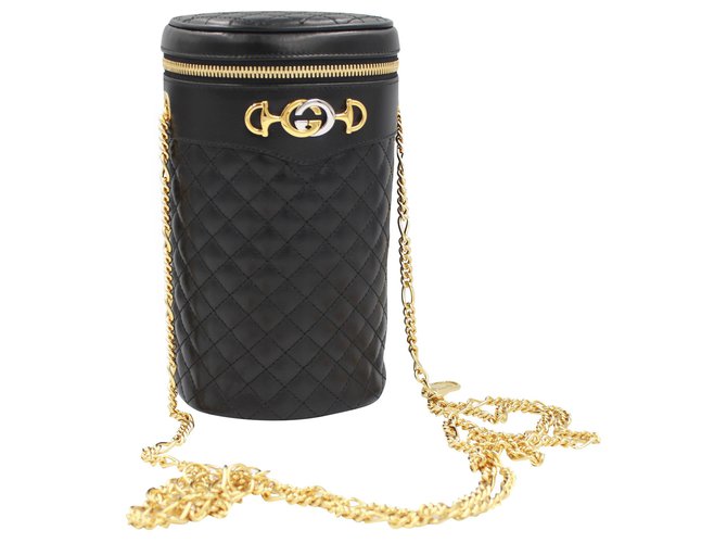 black gucci bag gold chain