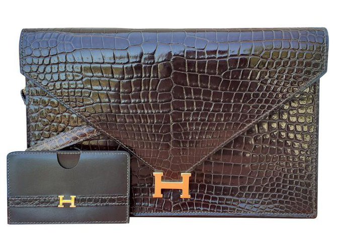 Bolsa Hermès Lydie em crocodilo marrom brilhante e porta-cartão combinando Castanho escuro Couros exóticos  ref.196049