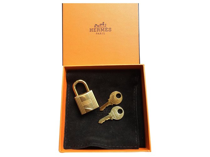 Hermès golden padlock for Birkin or Kelly handbag New Metal  ref.197301