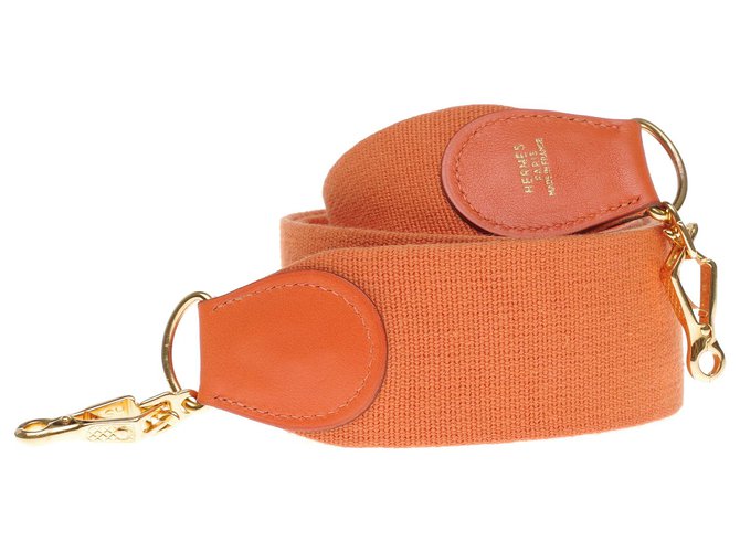 Bandoulière Hermès modèle sport en toile et cuir orange, garniture en métal doré pour sacs Hermès  ref.197318