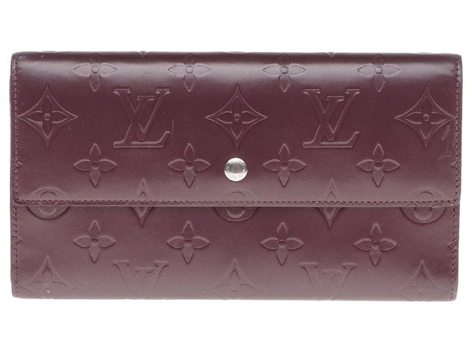 Louis Vuitton wallet in burgundy imprinted monogram leather, In