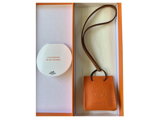Hermès Orange shipping bag charm Leather  ref.202599
