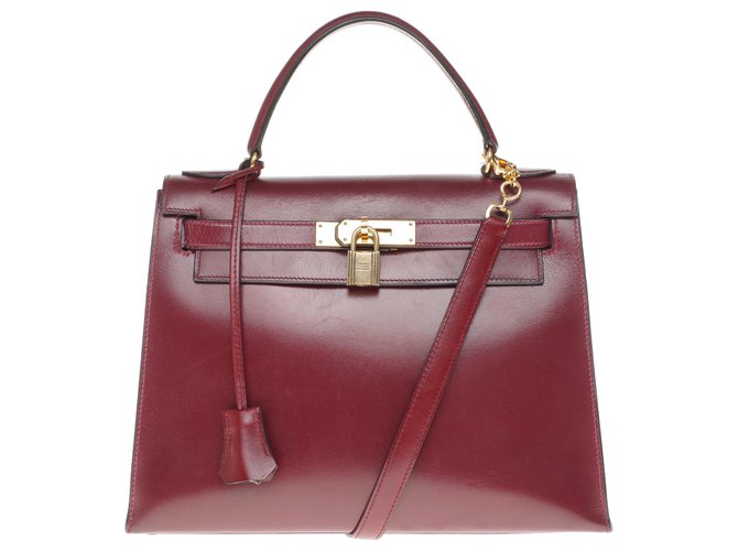 Beautiful Hermès Kelly bag 28 saddler with strap in red box leather H, gold-plated metal trim in very good condition! Dark red  ref.204275