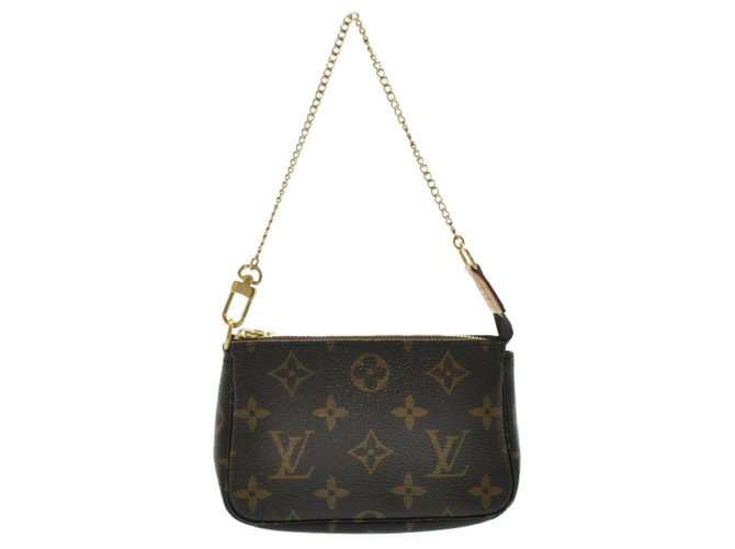 Pochette accessoire cloth handbag Louis Vuitton Brown in Cloth