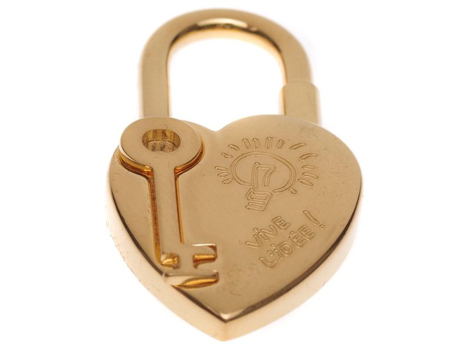 Hermès - Coleccionista / Candado raro "Corazón" en metal dorado para celebrar "el año de la fantasía 2004"  ref.206418