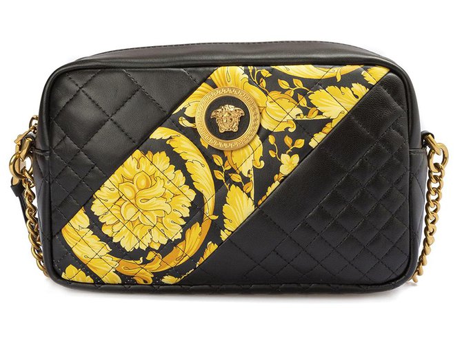 black leather crossbody bolsa with gold hardware