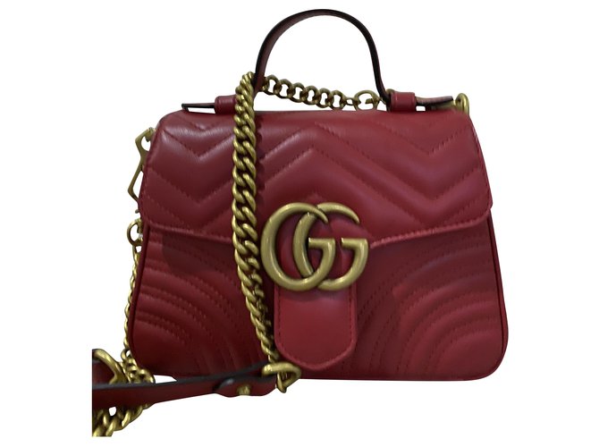 Gucci GG Marmont mini mala a tiracolo em pele acolchoada Vermelho Couro  ref.212085