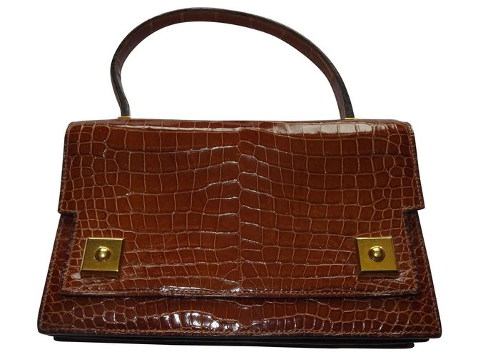 Hermès piano Brown Exotic leather  ref.212434