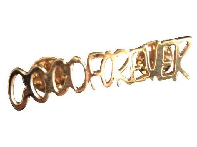 Chanel Alfinetes e broches Dourado Metal  ref.212500