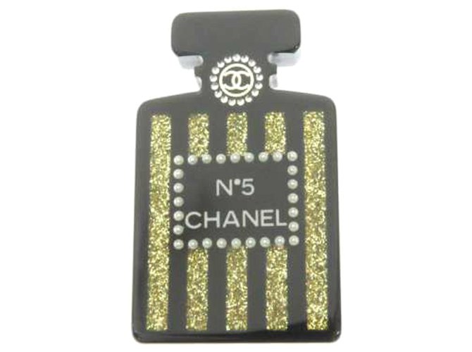 Chanel Black Chanel No5 Perfume Brooch Golden Plastic  ref.213628