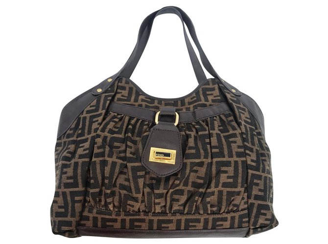 SOLD* Vintage FENDI Monogram Leather Handbag  Fendi bags, Leather handbags,  Vintage fendi bag