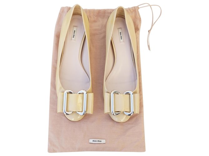 beige patent flats