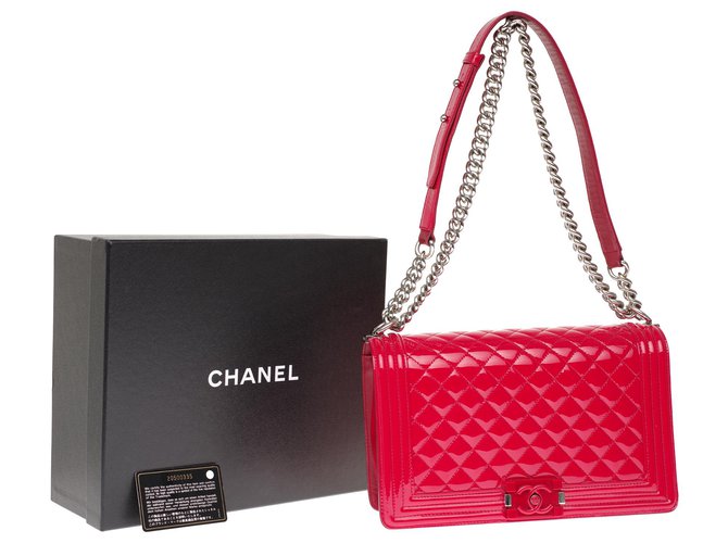 Superb Chanel Boy New medium bag (28cm) in red patent leather, red buckle  limited edition, antique silver metal trim, ref.222655 - Joli Closet