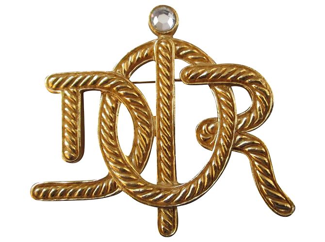 Dior Broche chapado en oro.